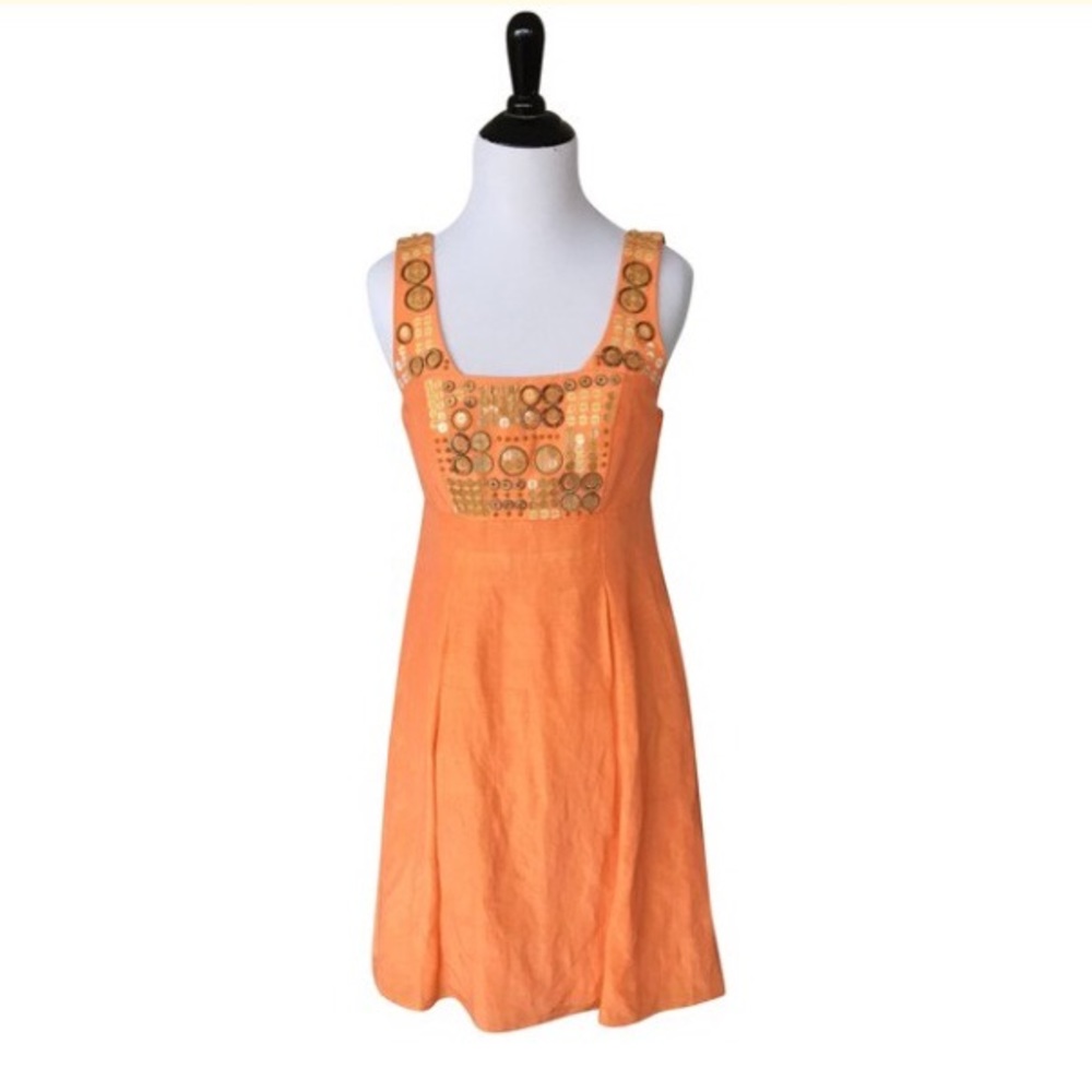 Orange dress with wooden embellishments